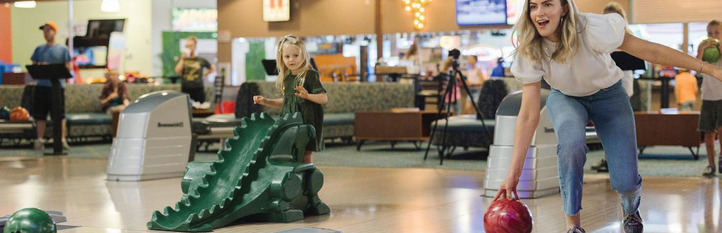 attractions-opt Woman bowling at Fiesta Fun Center